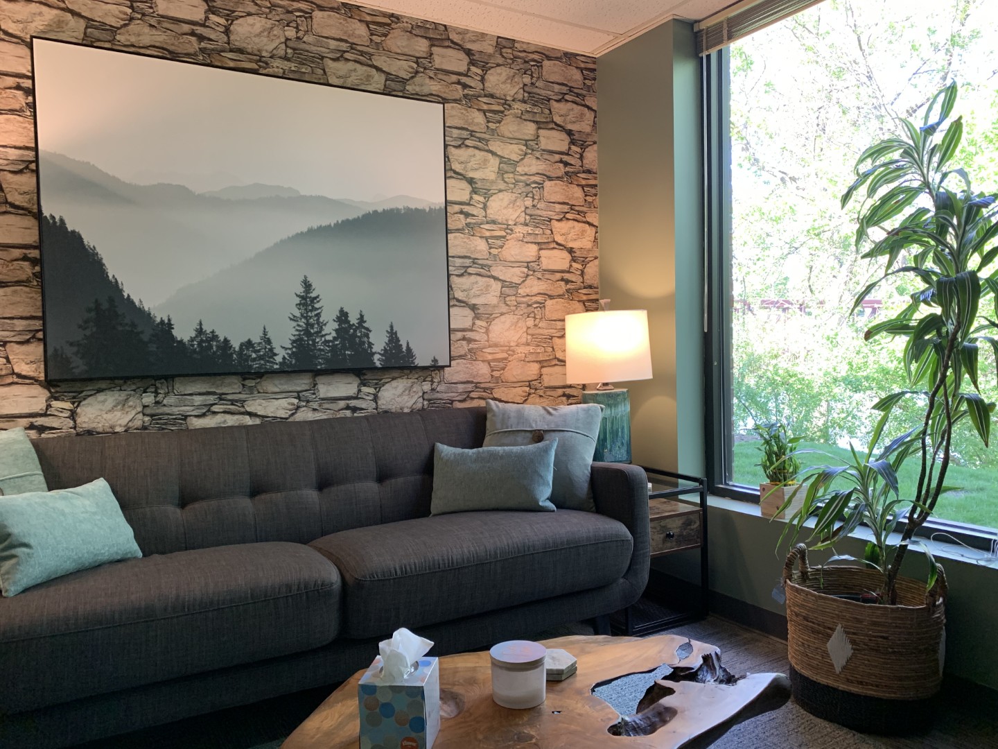 Cozy living room with nature-themed decor.